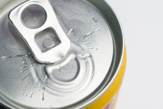 A close up photo of a closed can on a white background