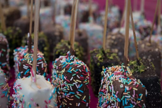 A group of colored chocolate candies for children