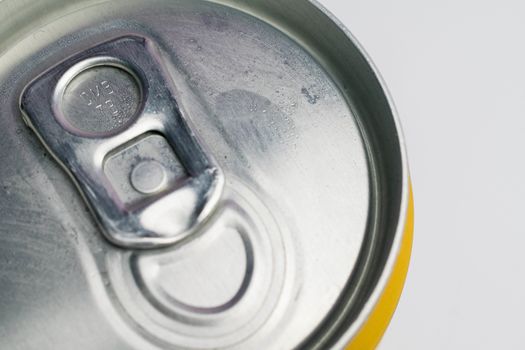 A close up photo of a closed can on a white background