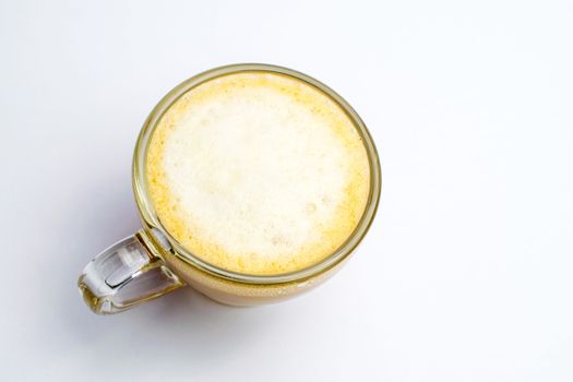 A cup of coffee and milk disposed on a white background