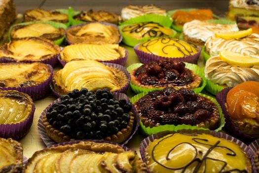 A group of patry little pies in a pastry shop