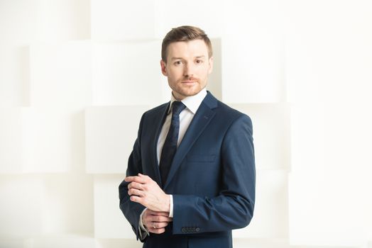 Portrait of man in black suit, groom, businessman concept