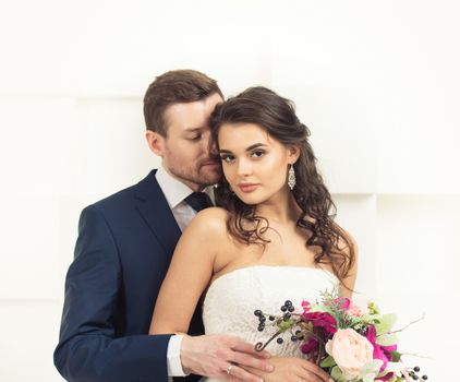 Bride and groom with bridal bouquet ready for wedding