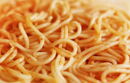close up of spaghetti in sauce