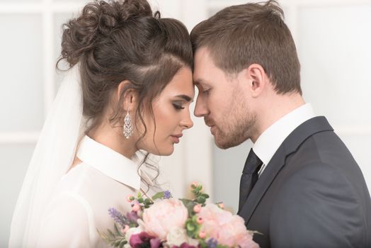 Bride and groom with bridal bouquet ready for wedding