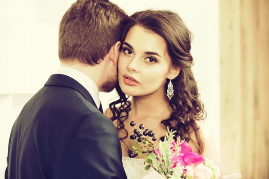 Bride and groom with bridal bouquet ready for wedding