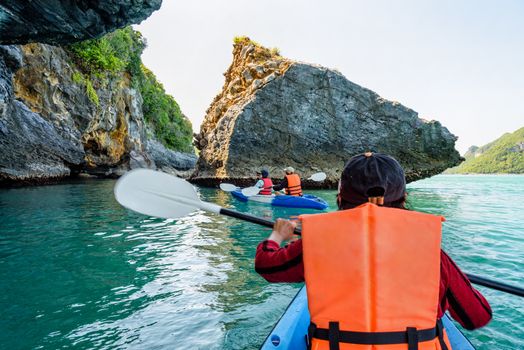 Group of tourists on a kayak.Travel by boat around Ko Phi enjoy the beautiful nature of the sea and islands in the summer at Mu Ko Ang Thong National Marine Park in Gulf of Thailand, Surat Thani province