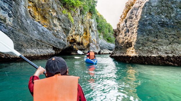 Group of tourists on a kayak.Travel by boat around Ko Phi enjoy the beautiful nature of the sea and islands in the summer at Mu Ko Ang Thong National Marine Park in Gulf of Thailand, Surat Thani province