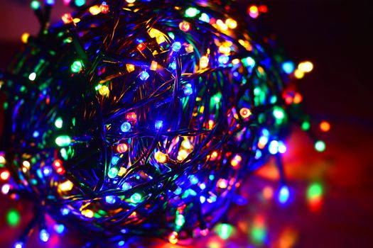 Closeup of a tangled multi color led string