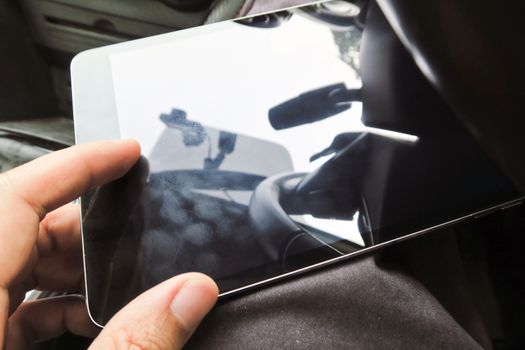 Close-up of female hands using digital tablet computer, hand presses on screen digital tablet with flare light background. Searching Internet ,Social Networking Concept