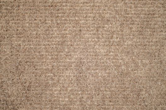 Brown carpet surface close up