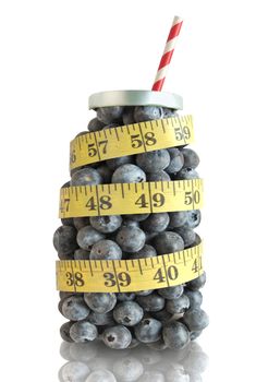 Blueberries i in the shape of a beverage with straw and measuring tape