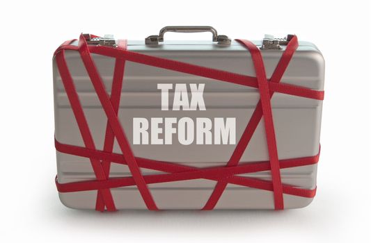 Tax reform printed on a briefcase tied with red tape