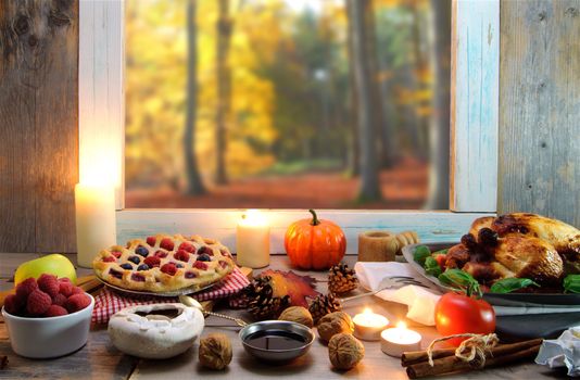 Thanksgiving meal by a window overlooking a forest