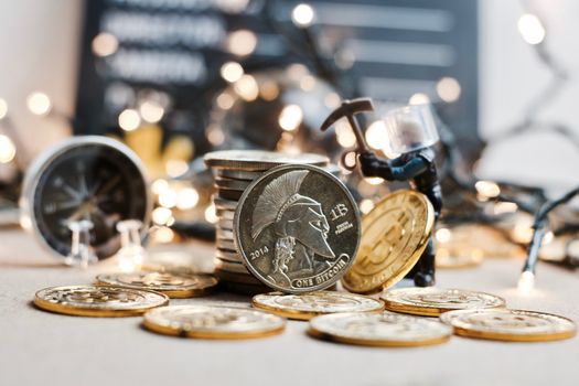 Digital currency physical metal coin. Christmas cryptocurrency concept.