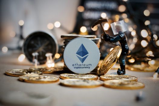 Digital currency physical grey ethereum token. Bitcoin mining concept.