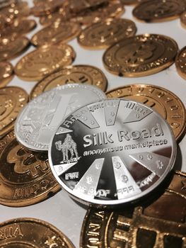 Digital currency physical metal litecoin coin near bitcoin coins. Money concept.