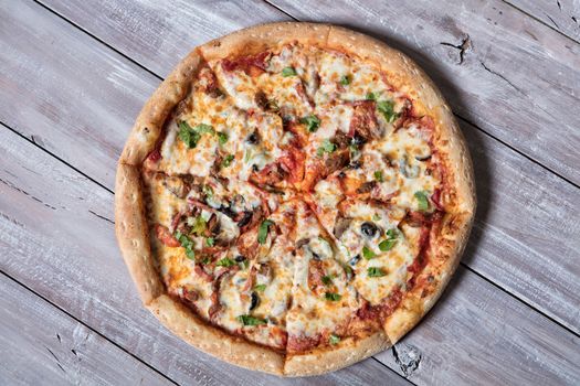 Pizza on an old wooden table