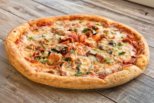 Pizza on an old wooden table