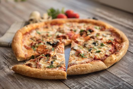 Pizza on an old wooden table