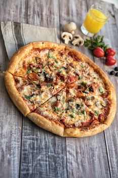 Pizza on an old wooden table