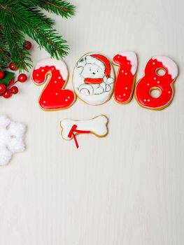 Christmas background with gingerbread, Christmas trees and snowflakes with pine cones. 2018 year of the dog