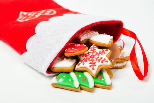 Christmas concept. Christmas sock with gingerbread on white background