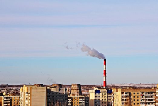 The thermal power plant pollutes the air in the residential area of the city.