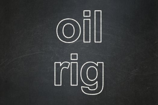 Manufacuring concept: text Oil Rig on Black chalkboard background