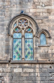 Medieval window of Palau Reial Major in Placa del Rei, public square of the Gothic Quarter in Barcelona, Catalonia, Spain