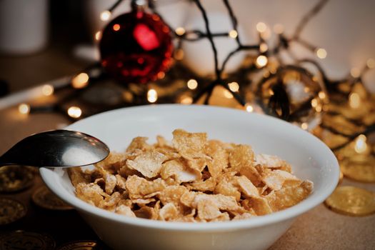 Delicious and fresh corn flakes in white bowl. Christmas food concept.