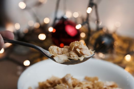 Delicious and fresh corn flakes in white bowl. Christmas food concept.