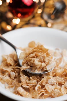 Delicious and fresh corn flakes in white bowl. Christmas food concept.