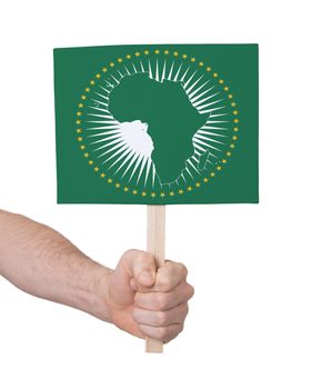 Hand holding small card, isolated on white - Flag of African Union