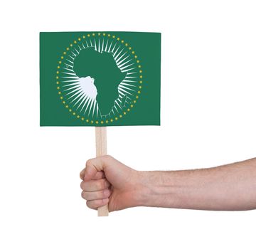 Hand holding small card, isolated on white - Flag of African Union