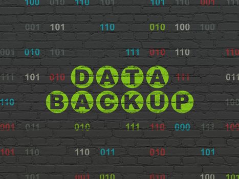 Data concept: Painted green text Data Backup on Black Brick wall background with Binary Code