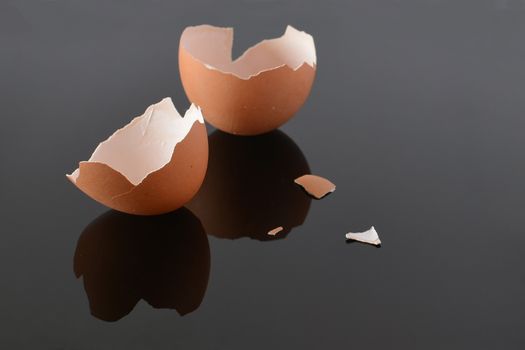 Cracked egg shells on a black background