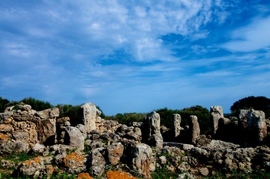 Ancient Megaliths Talaiot Settlement of So na Cacana against Blue Sky Outdoors. Menorca, Balearic Islands
