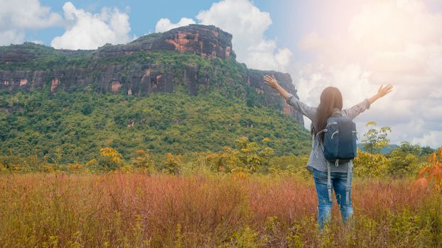 Asian woman backpacker enjoy the view at mountain