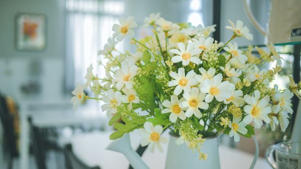 A bouquet of artificial flowers in pot