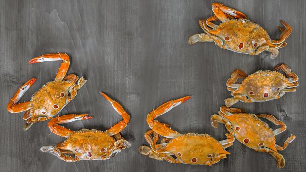 Food frame with crustacean . crab on wooden background