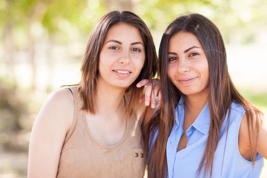 Two Beautiful Ethnic Twin Sisters Portrait Outdoors.