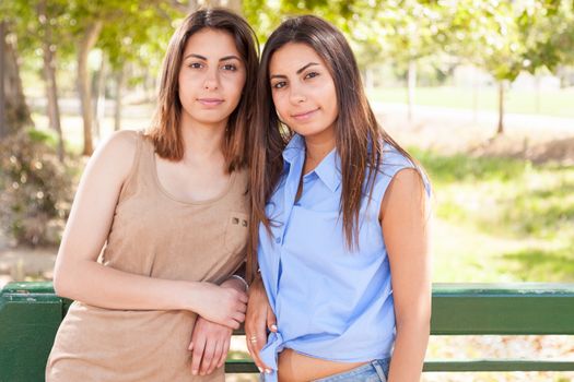 Two Beautiful Ethnic Twin Sisters Portrait Outdoors.