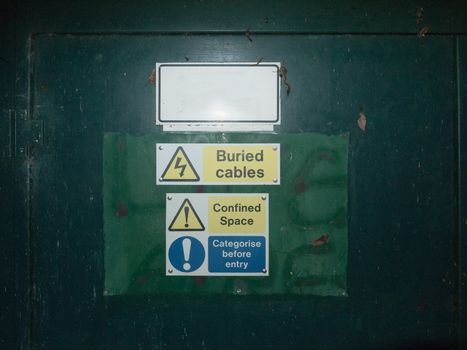 bunch of safety signs water green box yellow triangle; essex; england; uk