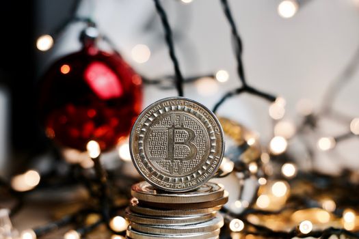 Crypto currency physical metal bitcoin coin. Digital currency christmas concept.