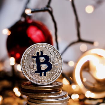 Crypto currency physical metal bitcoin coin. Digital currency christmas concept.
