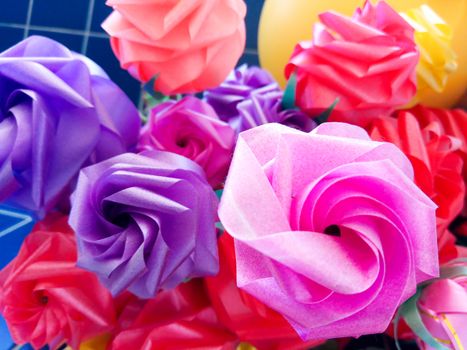 Rose fake flower and Floral backgroundrose flowers made of fabric. The fabric flowers bouquet. Colorful of decoration artificial flower.