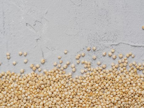 Grain of quinoa. Uncooked raw quinoa as background. Healthy vegan food concept and pattern. Copy space. Top view or flat lay