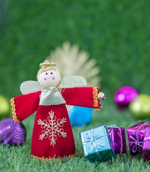 Celebration of New year and Christmas,Close up Christmas decoration on green grass background with copy space