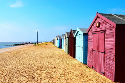 Row of beach huts on Suffolk coast line
